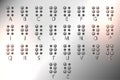 Metal Braille alphabet, tactile writing system used by blind or visually impaired people.